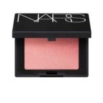 NARS Orgasm Mini Blush 1.2g – Iconic peachy pink blush with golden shimmer for a natural radiant glow.
